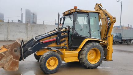 Колесный экскаватор CAT 428DII с гидромолотом